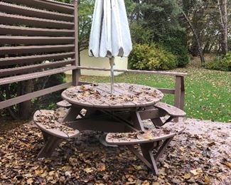Round cedar picnic table with umbrella.  Leaves are free!