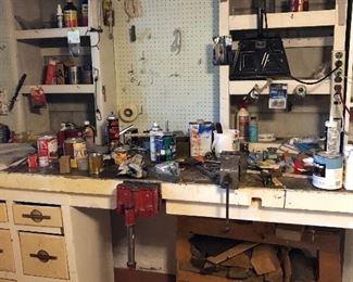 Lots of items left on the work bench. 