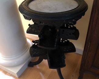 Antique occasional table with marble top. Most likely a book stand.