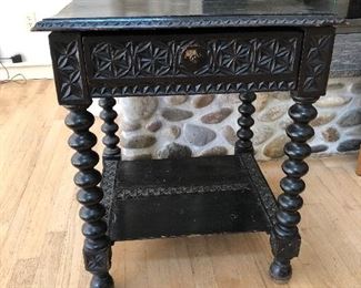 One of several Antique Spanish heavily carved ebonized wood furnishings 