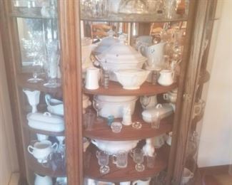 Lots of China and decorative items. Wooden china cabinet