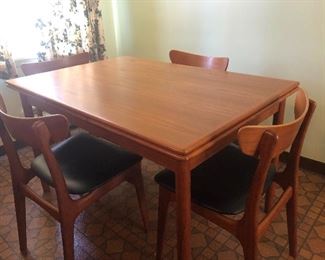 Danish teak dining table with extensions and 4 chairs (from Viking International)