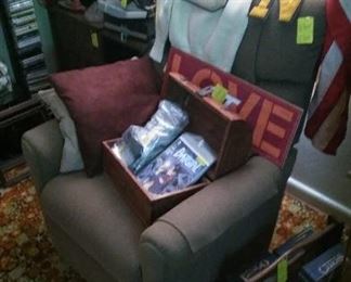 Lazy Boy recliner, nautical items, letter sweater, magazine rack, games, etc.