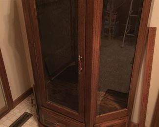 Oak/glass display cabinet - three drawers on bottom-two glass shelves.
