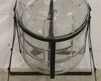 Tilting bottle in rack