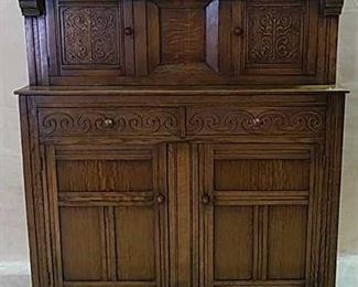 English oak linen fold cupboard