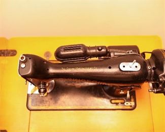 2nd Antique Singer Sewing Machine with Attached Lamp Light and Cabinet at This Sale.