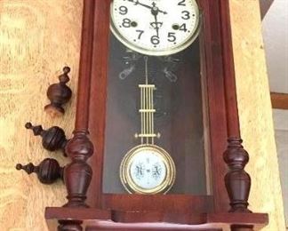 R A Prince 31 Day Wall Clock	
Dark Wood, Finials are loose but with the clock; 11"w x 6-1/2"d x 32"h