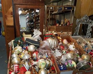 Christmas ornaments in front of framed mirrors