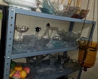 Glass baskets (wicker handles); glass items; hanging candle lamp in amber