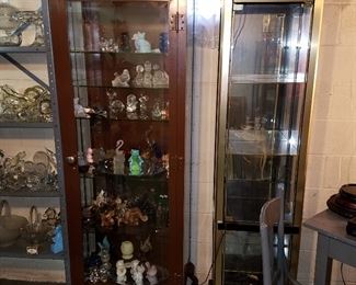Curios: Left: Metal frame with beveled glass (originally a locking medical cabinet from Dr. Office or Hospital). Left cabinet full of Fenton and other glass figures, Right cabinet is lighted