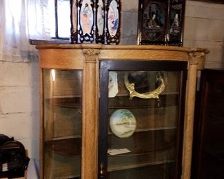 Curved china cabinet (right glass panel missing) Partially stripped of original finish showing oak construction