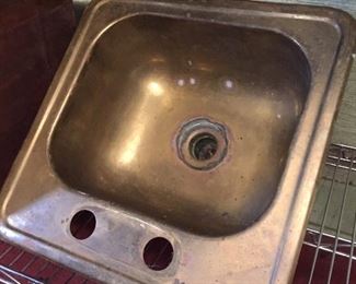 Small brass sink.