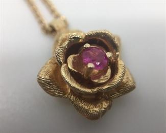 14k Flower Pendant with Ruby https://ctbids.com/#!/description/share/274651