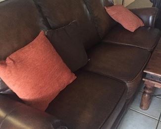 Three cushion leather sofa with nailhead detail