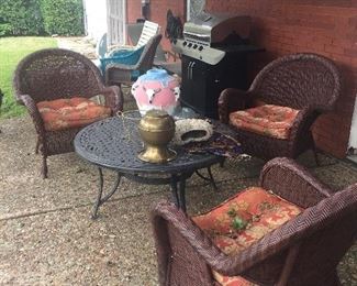 Great outdoor woven chairs, large grill, outdoor pottery, metal outdoor furniture