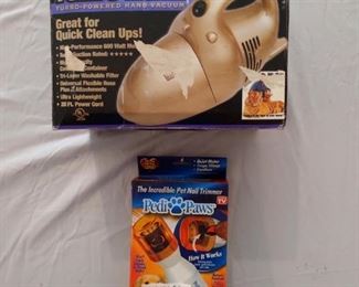 Hand held vac with pet nail trimmer