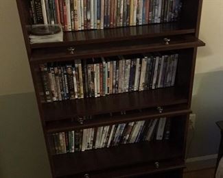 Lots of DVDs and Lawyer bookcase