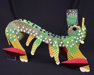“Big Man on Campus” Sculpture. Mixed media sculpture of a seven-legged creature, titled "Big Man on Campus". Multi-color painted wooden body with applied tiles, and cabochons. No visible signature, numbered "49". Minor surface wear, one of four supporting legs missing, ½" hole drilled in underside for display mounting. Measures 26" x 16" high. Reference #K.15 