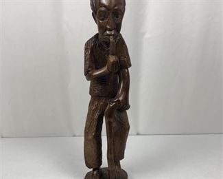 Lot 034
Tall Man Smoking Pipe Hand Carved From One Piece Of Wood 21”