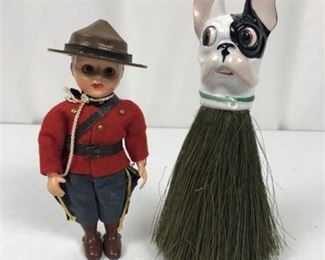 Lot 111
Mounted Canadian Police Kewpie Doll & German Porcelain Coat Brush