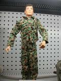 Vintage 1964 GI Joe in Camoflage. Stand Not included. Looks to us that may have been produced between 1967 and 1970. Very collectable