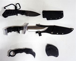 Three Knives, Includes Strider 8.5" OL In Hard Sheath, "Best Defense" 10" OL In Nylon Sheath And Curved Knife With Ringed Handle In Hard Sheath