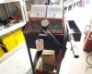 4030: Auto Meter Battery Tester with Cart
Measures approx 16"x13"x40" Also includes some screws and a Delco Remy Delcotron