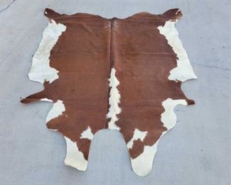 1031: Cow Hide Rug
Measures approx 8'4"x7'