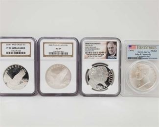 2030: Four .900 Silver Coins
Two 2008 P Bald Eagle S$1 .900 Silver Coins. Grades are: MS 70 and PF 70 Ultra Cameo. One 2015 W S$1 March Of Dimes Set PF 70 Ultra Cameo. One 2015 Commemorative Inaugurated President John F. Kennedy Chronicles Set PCGS MS70