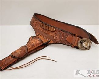 894: Leather Belt with Belt Buckle and Holster
Belt measures approx 40", belt buckle measures approx 4" x 3", holster measures approx 12"