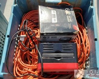 #4107 • Various Electric Items Includes two battery chargers in great condition, and several power extension chords