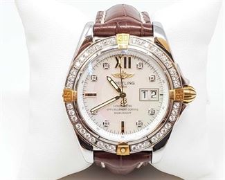 1105: Breitling Diamond Bezel Wrist Watch with Mother of Pearl Face - Authenticated!
Measures approx 42mm. Markings on back B49350, 935703