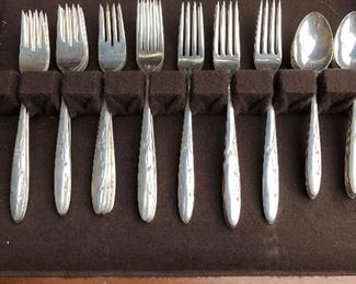 12 place settings with serving pieces