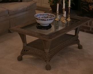 Wicker Coffee table, mixed grouping of candlesticks and fine porcelain center bowl.