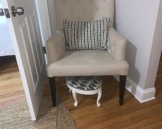 Tufted chair , pillow , rug, and foot stool