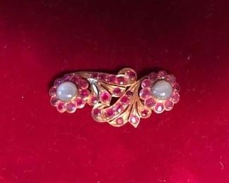 I believe this is old, moonstone, rubies(?)