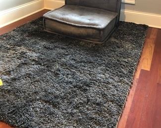 Gray area rug and gaming chair
