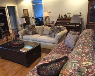 2 sofas, - piano in background
