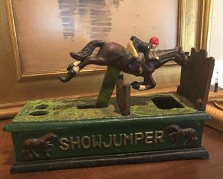 Cast iron show jumper coin bank- NEAT!