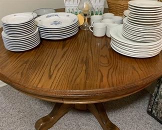 Large set of white dishes and Pedestal Table