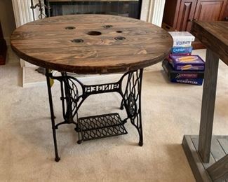#24 Singer treddle machine base with refinished spool top 36" round by 29" tall $ 225.00
