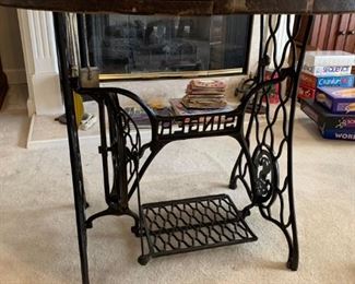 #24 Singer treddle machine base with refinished spool top 36" round by 29" tall $ 225.00
