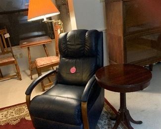 Blue recliner
Deep red carpet
Pedastal table