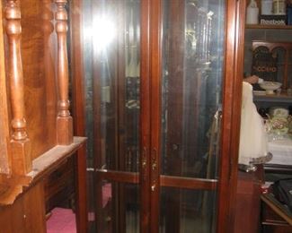 display cabinet with glass shelves and lights