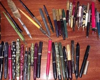 variety of fountain and ball point pens