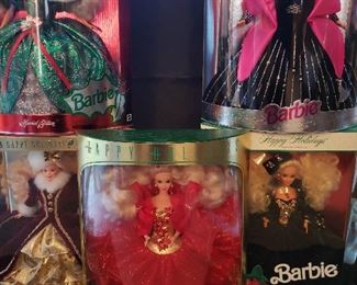 Happy Holiday Barbie, all new in unopened boxes. Includes 1st in series, 1988; also 1991 - 1998