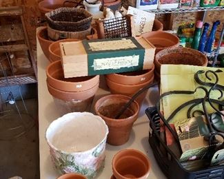 Tons of clay pots, iron pot hangers and garden accessories