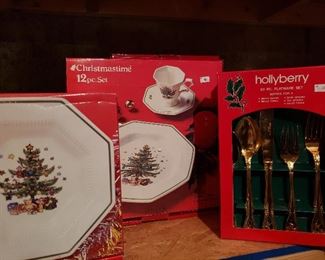 Three 12pc sets of Nikko Christmastime dinner plates, one set of four salad plates and three 20pc Hollyberry silverware sets