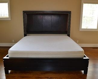 Lexington king sized platform bed with leather studded headboard and memory foam mattress.   64" high headboard